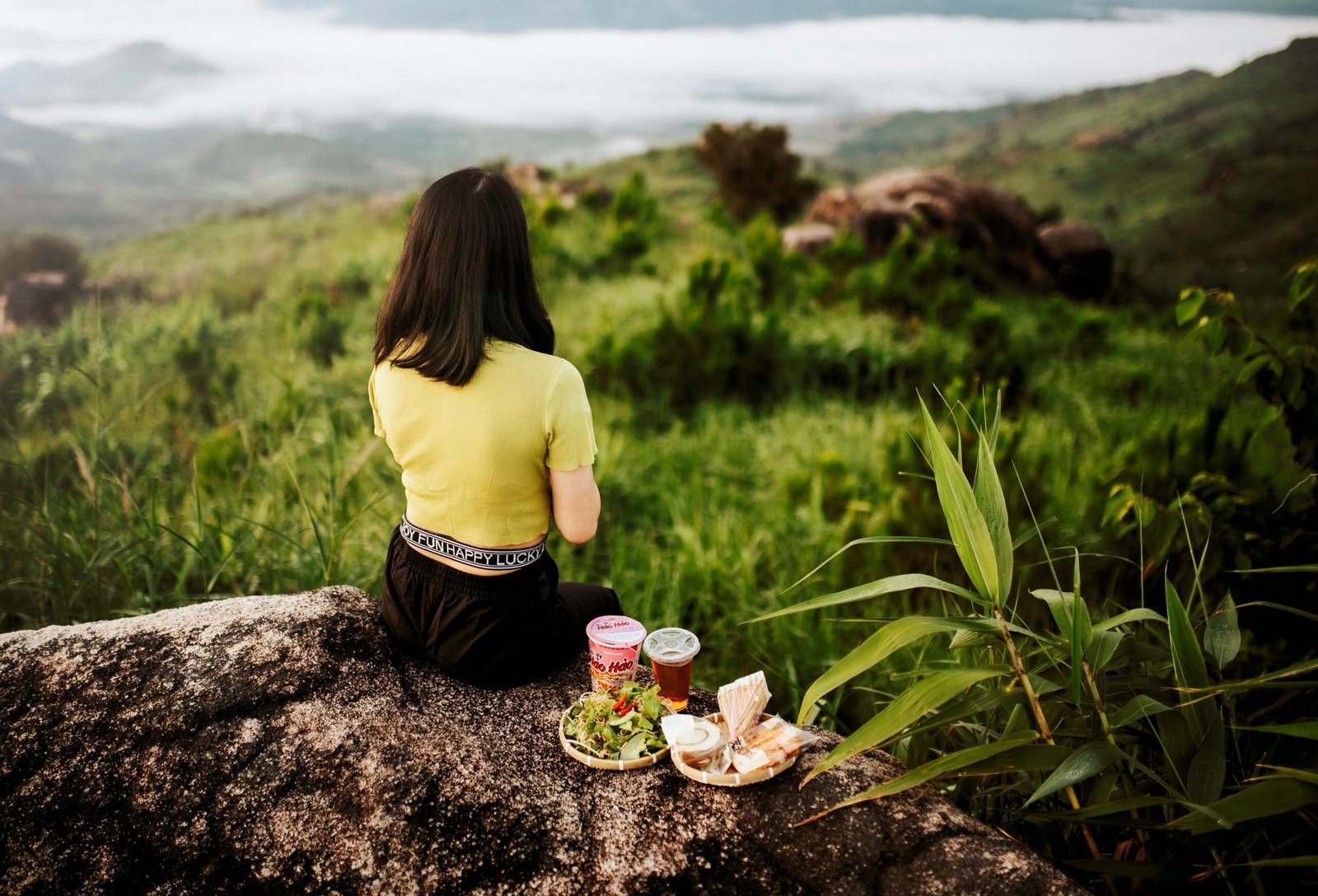 Person enjoying quiet reflection outdoors, symbolizing mindfulness and inner clarity.