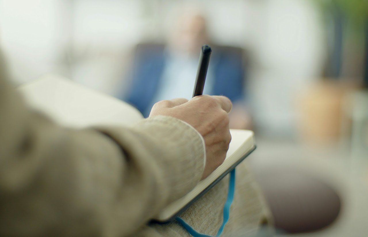 blogs about a person writing her thoughts in a notebook