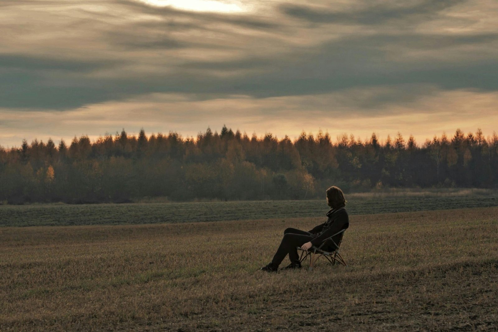 Me sitting on a bench alone with my thoughts and fighting my inner critic