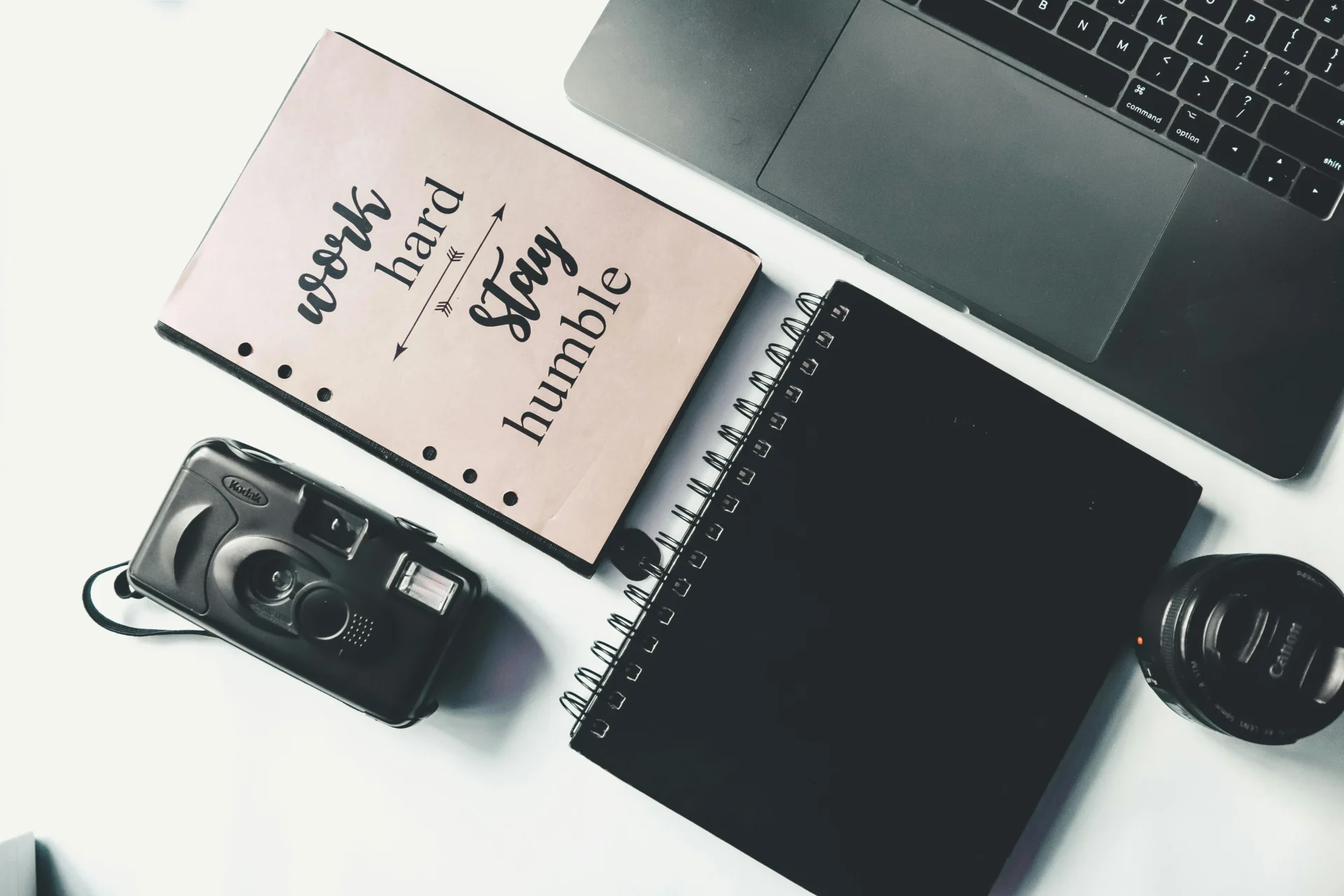 Minimal content writing workspace with laptop, notes, and editorial planning setup representing SEO writing, copywriting, and digital content strategy.